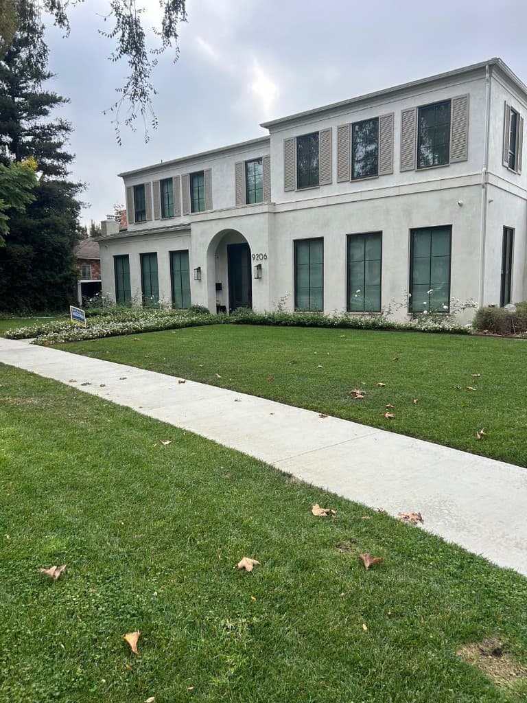 Elegant Los Angeles home with broad lawn and stately facade
